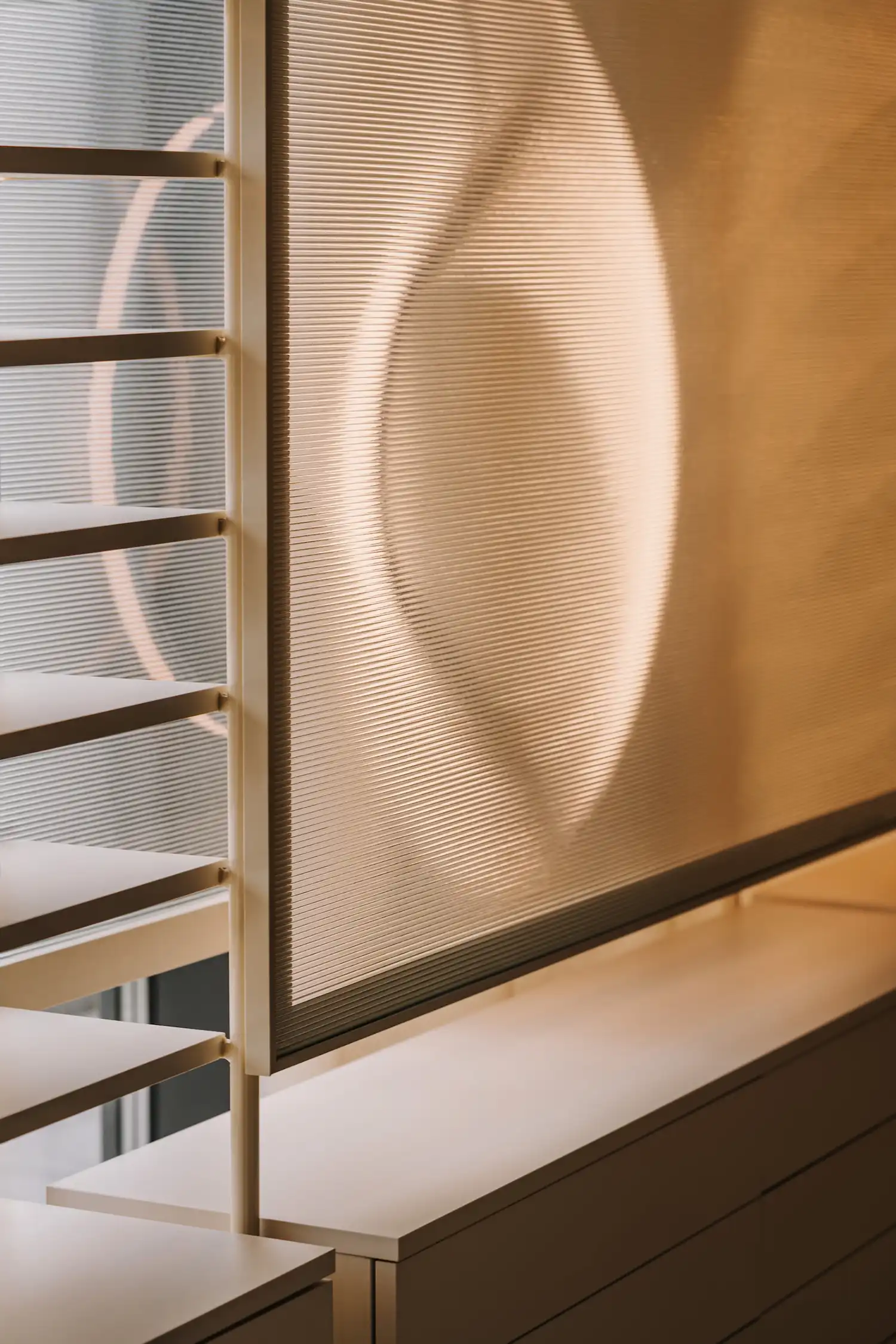 Close-up of a textured glass screen with a circular light projection.