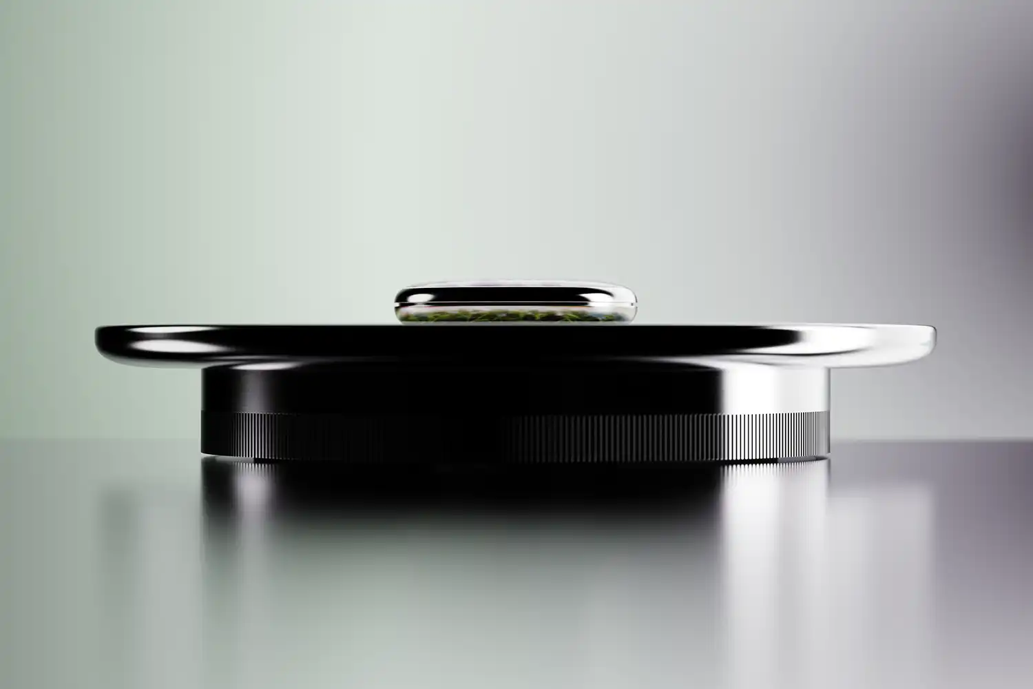 Side profile of the minimalist Garden AI device showing its thin, high-end industrial design.