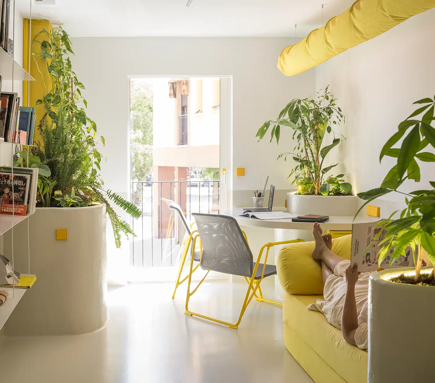 Translucent curved polycarbonate volume with a silhouette of a hand and blurred interior shelves.