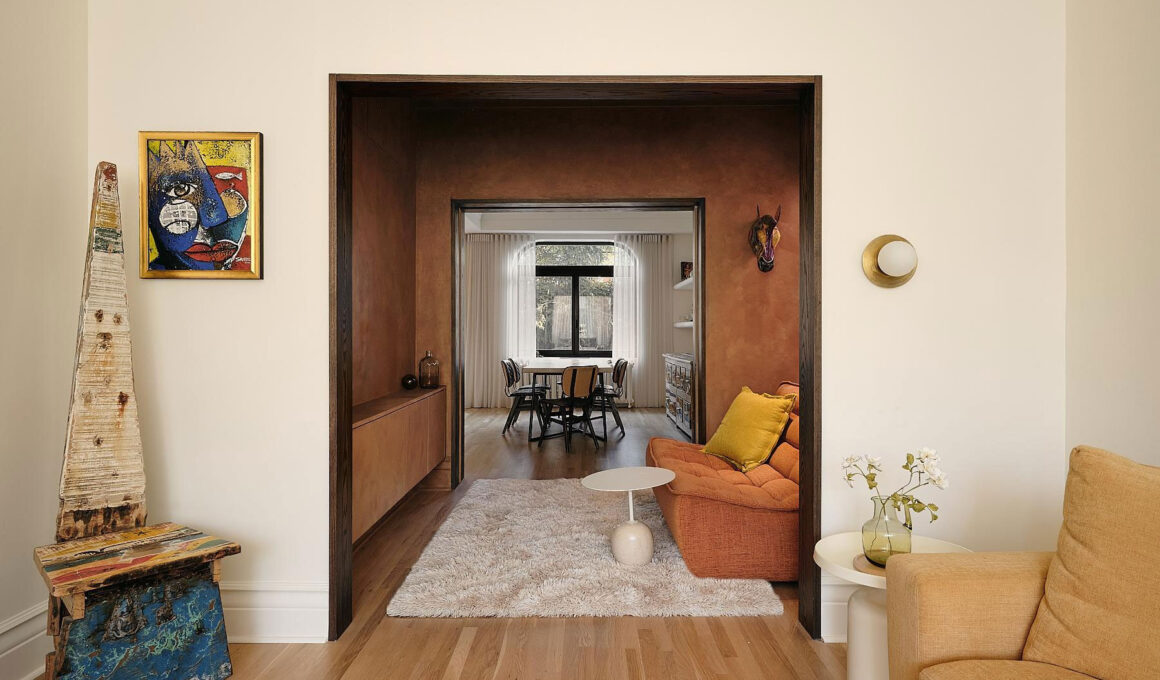 A series of arched openings and limewash textures create a fluid domestic flow punctuated by personal artworks.