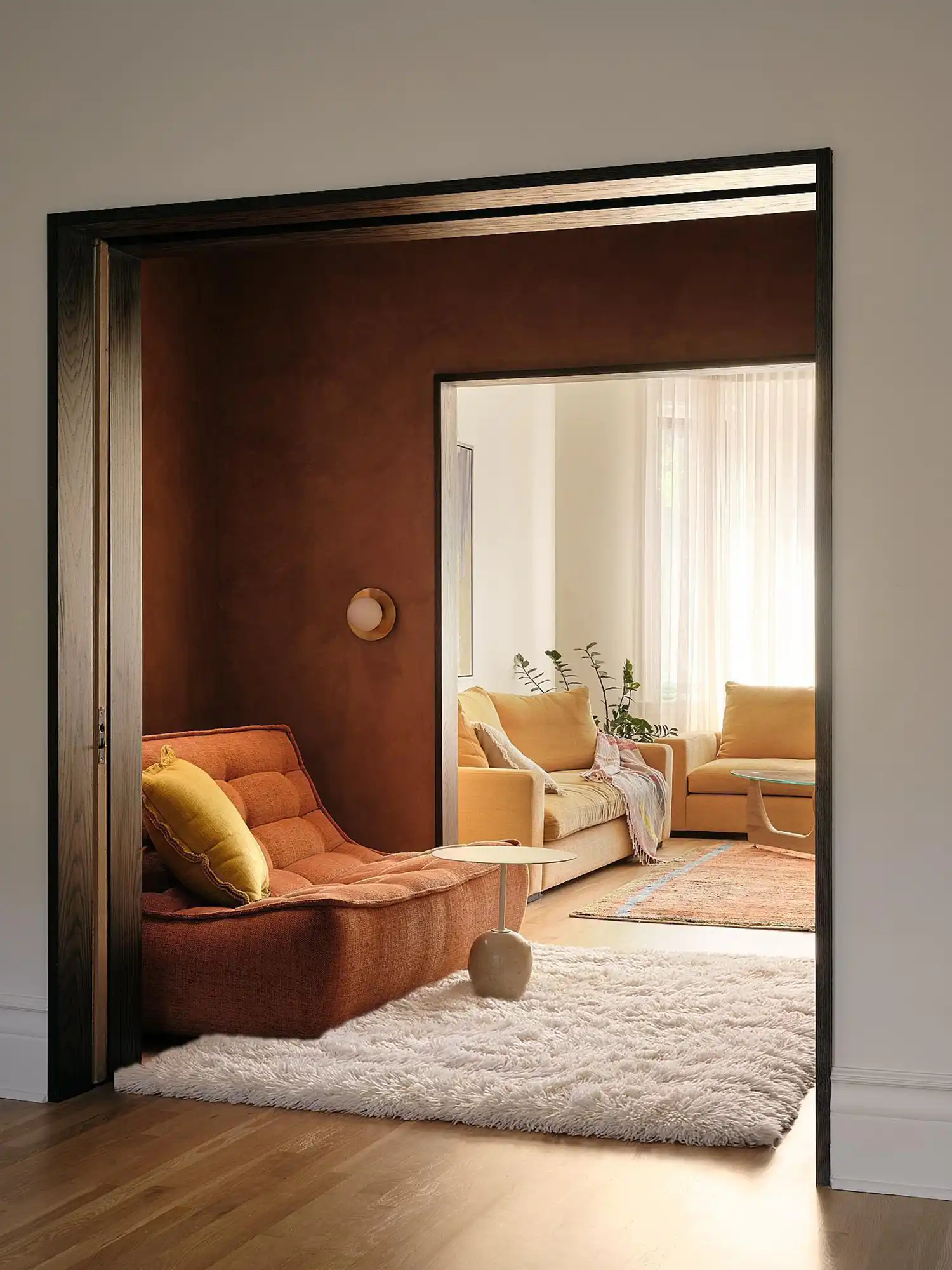 Intimate seating areas utilize warmth and texture to evoke the eclectic cultural fragments of the clients' travels.