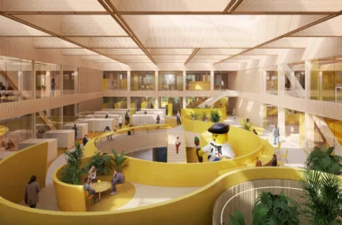 Rendering of the LEGO Innovation Campus brick library featuring a large yellow spiral ramp and giant LEGO Minifigure.