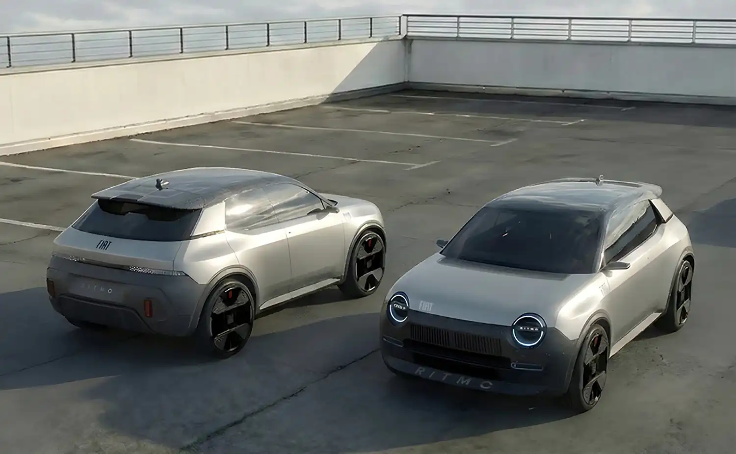 Two modern Fiat Ritmo concepts in an outdoor parking setting