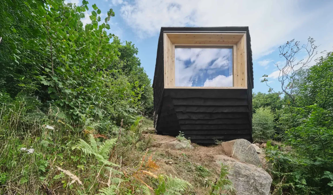 Forestone cabin charred timber facade large window Pyrenees