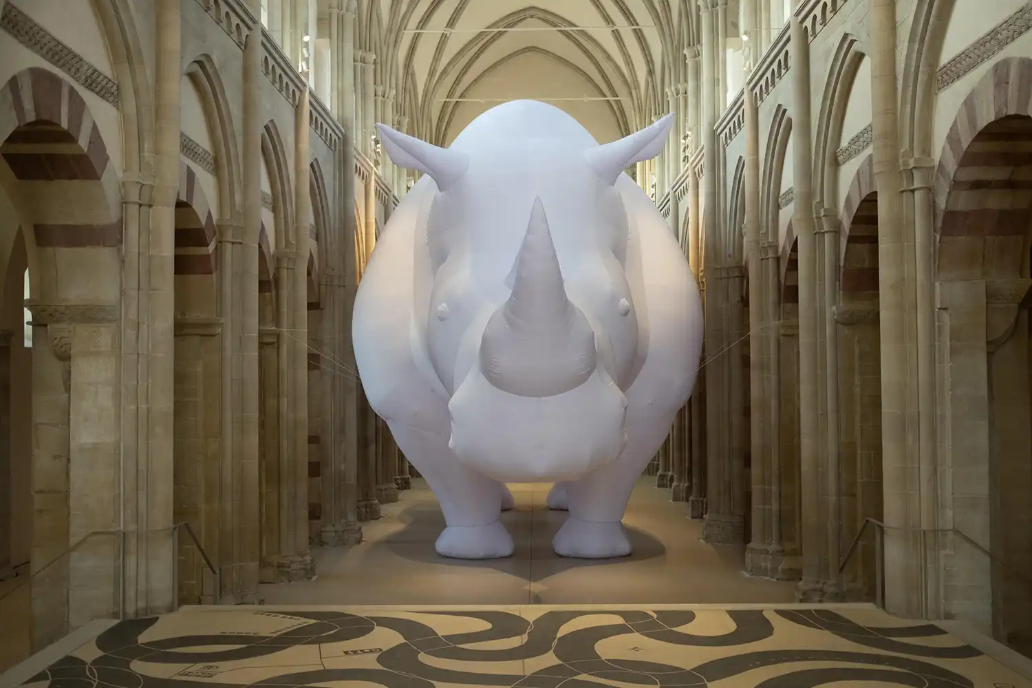 Front view of 17-metre inflatable rhinoceros in Kunstmuseum Magdeburg nave