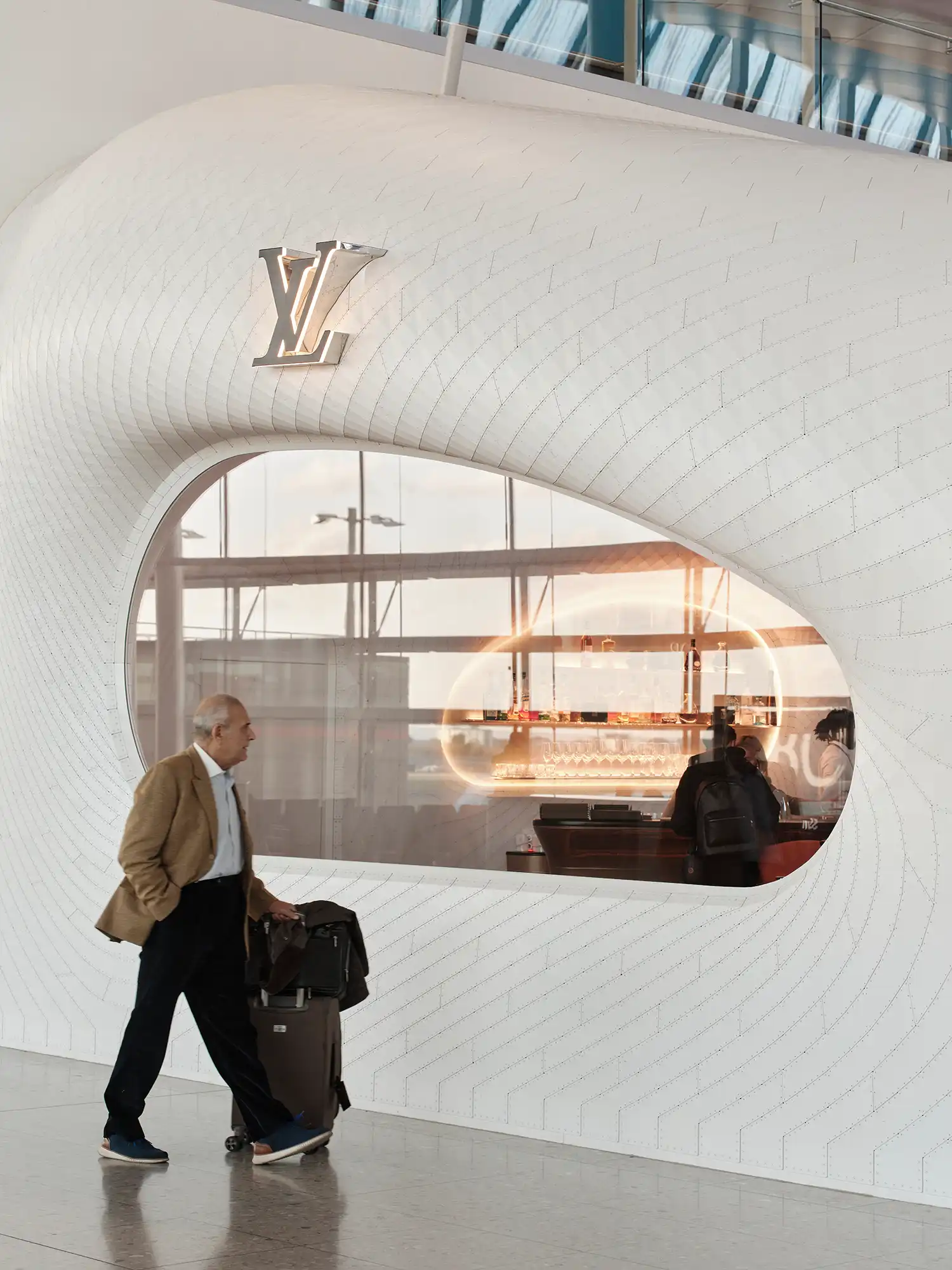Louis Vuitton logo on perforated aluminum shell Heathrow