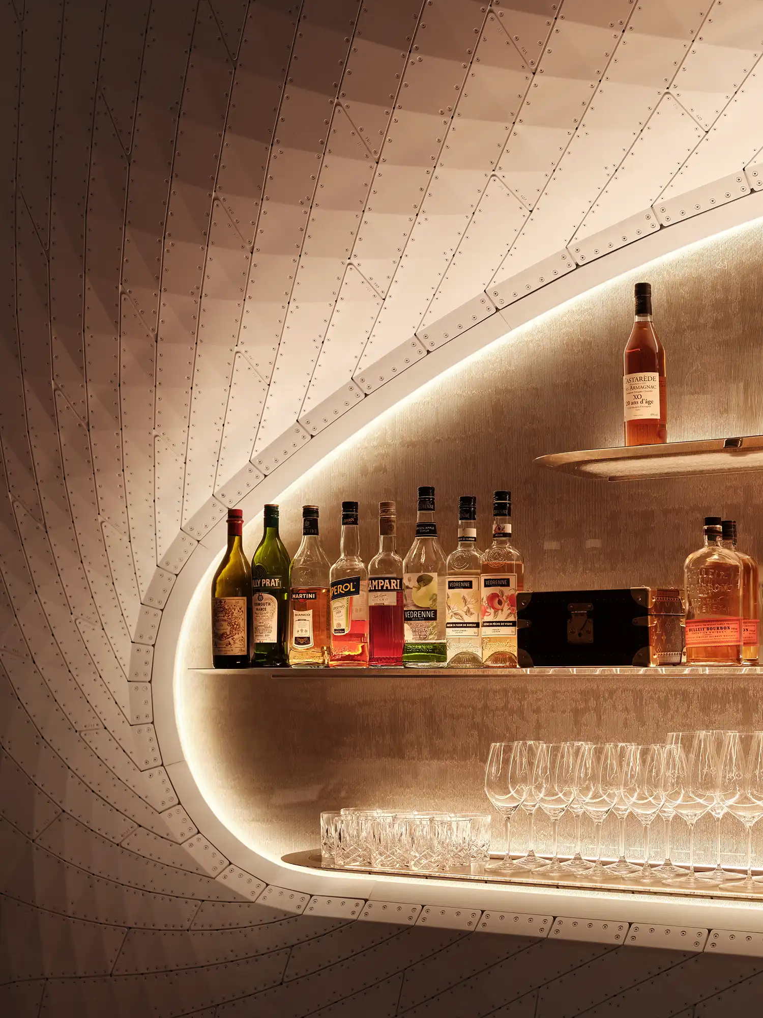 Detail of backlit bottle display Louis Vuitton café
