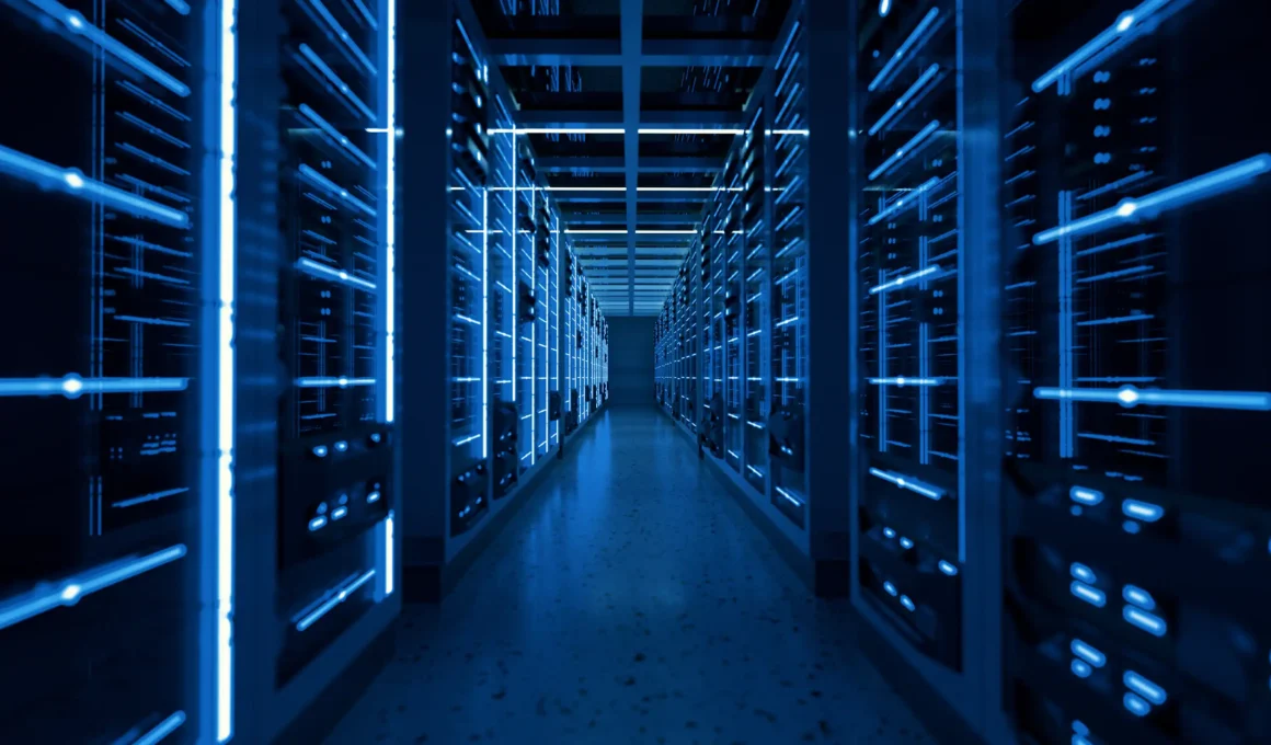 Symmetrical view of a modern high-tech data center corridor with glowing blue lights, representing the shift from legacy POTS to digital infrastructure.
