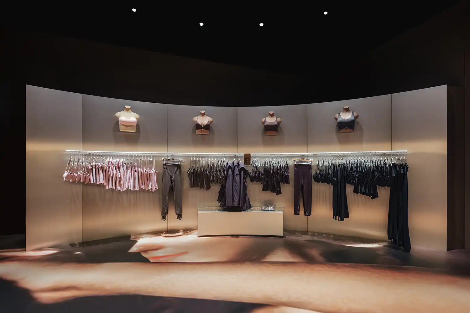 Brushed metal display walls Nike SKIMS Paris Crosby Studios