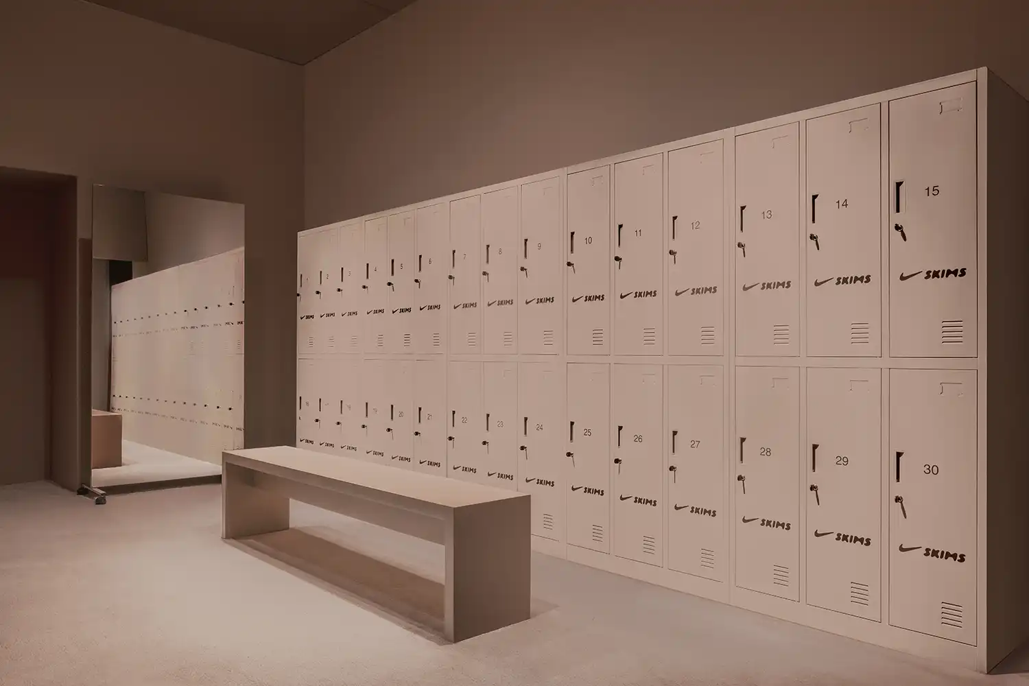 Industrial locker room design Nike SKIMS Paris pop-up