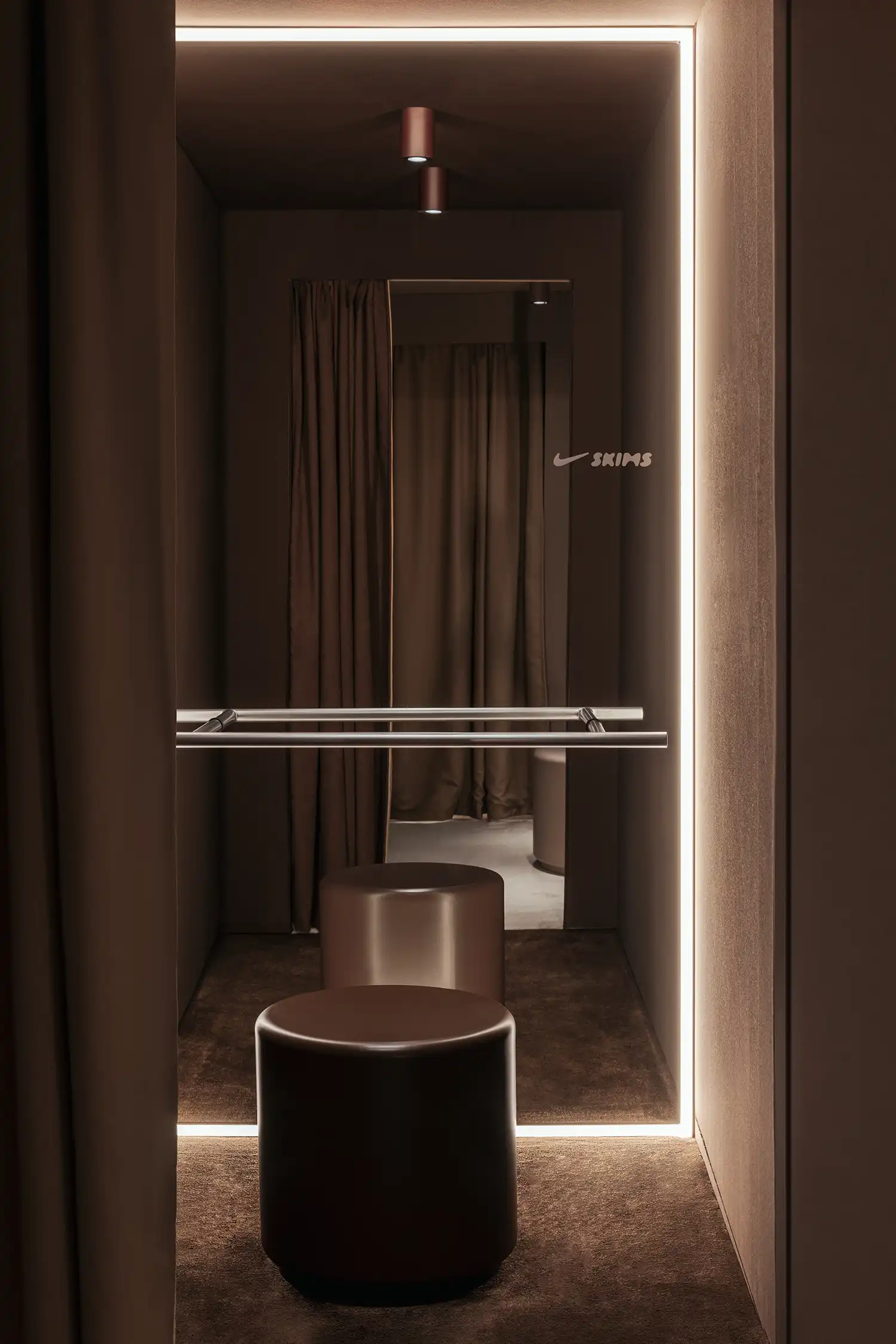 Minimalist fitting room design Nike SKIMS Paris