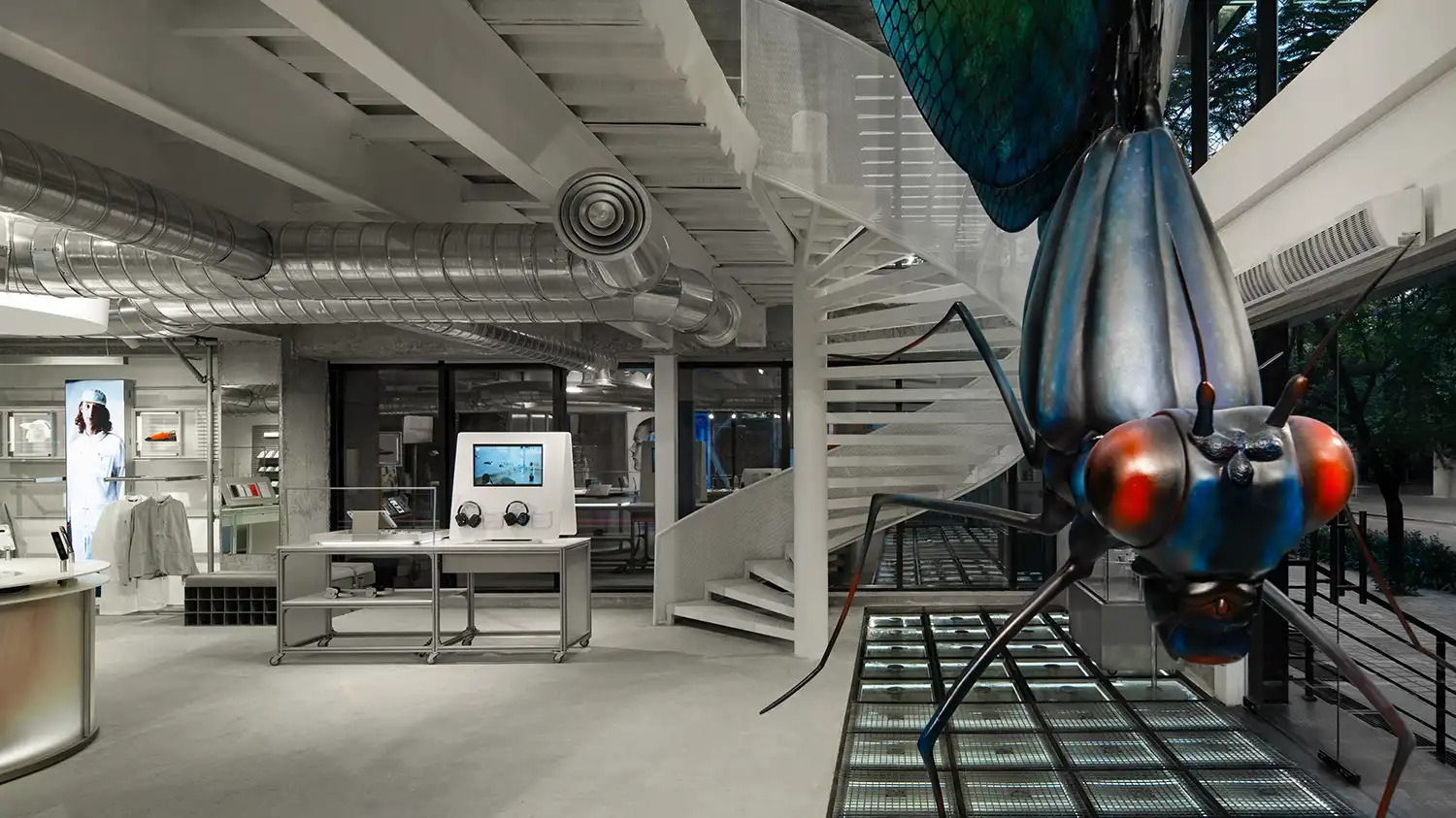 Giant beetle installation and spiral staircase in Nothing Store