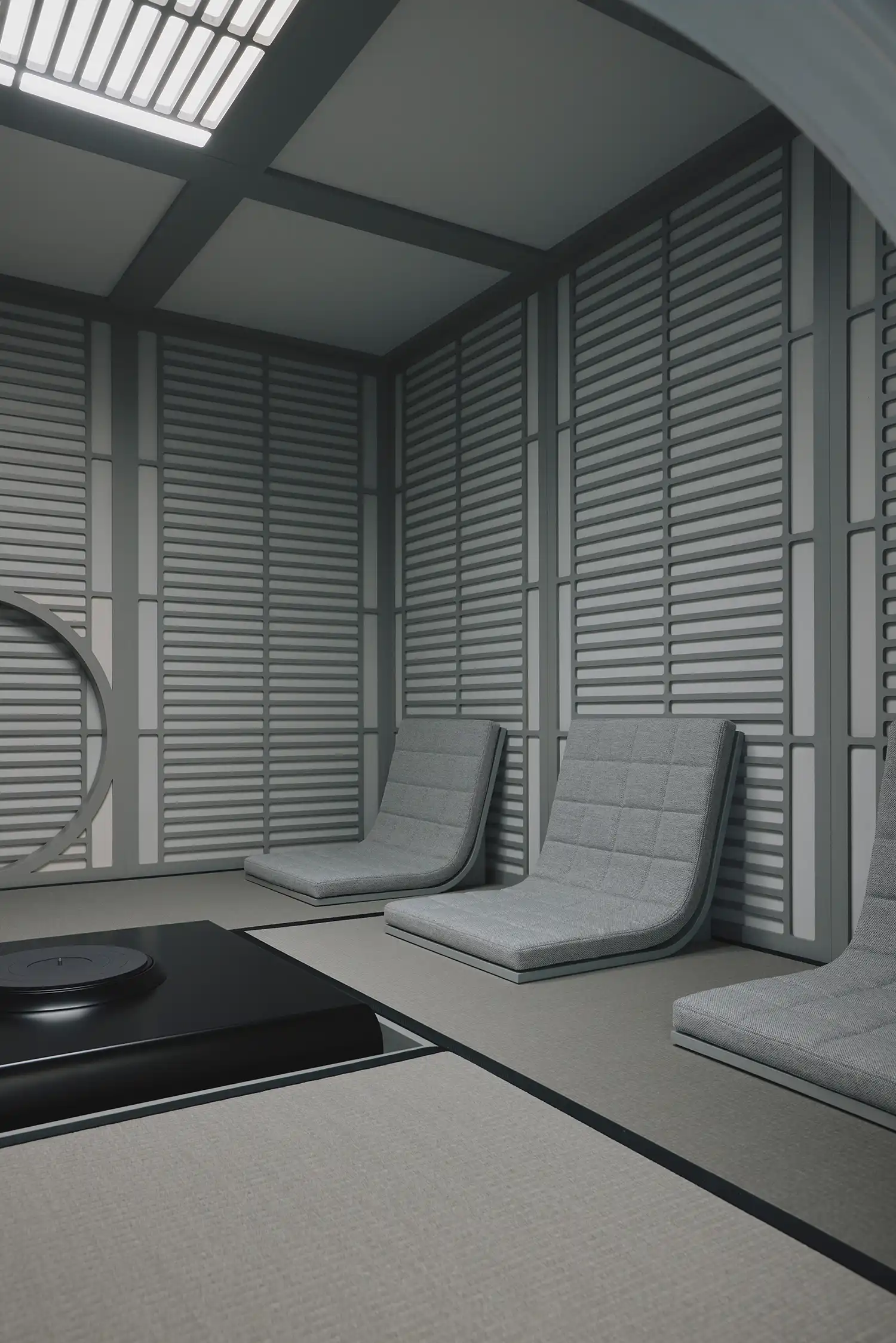 Low-profile floor seating arranged for intentional listening inside the specialized audio environment.