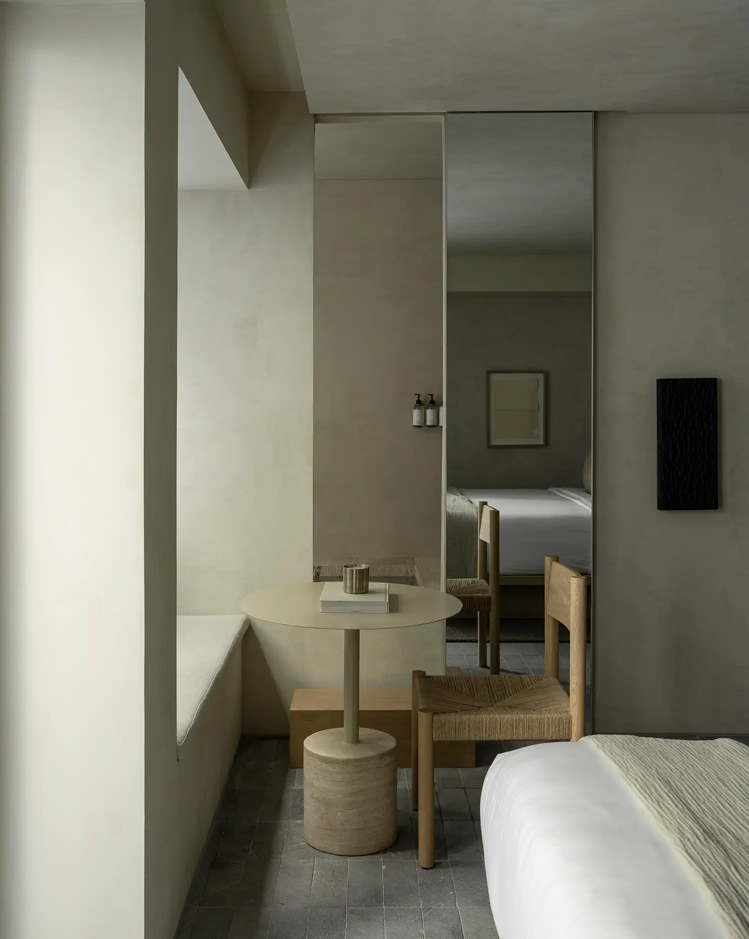 Boutique hotel room interior with stone table PPAA