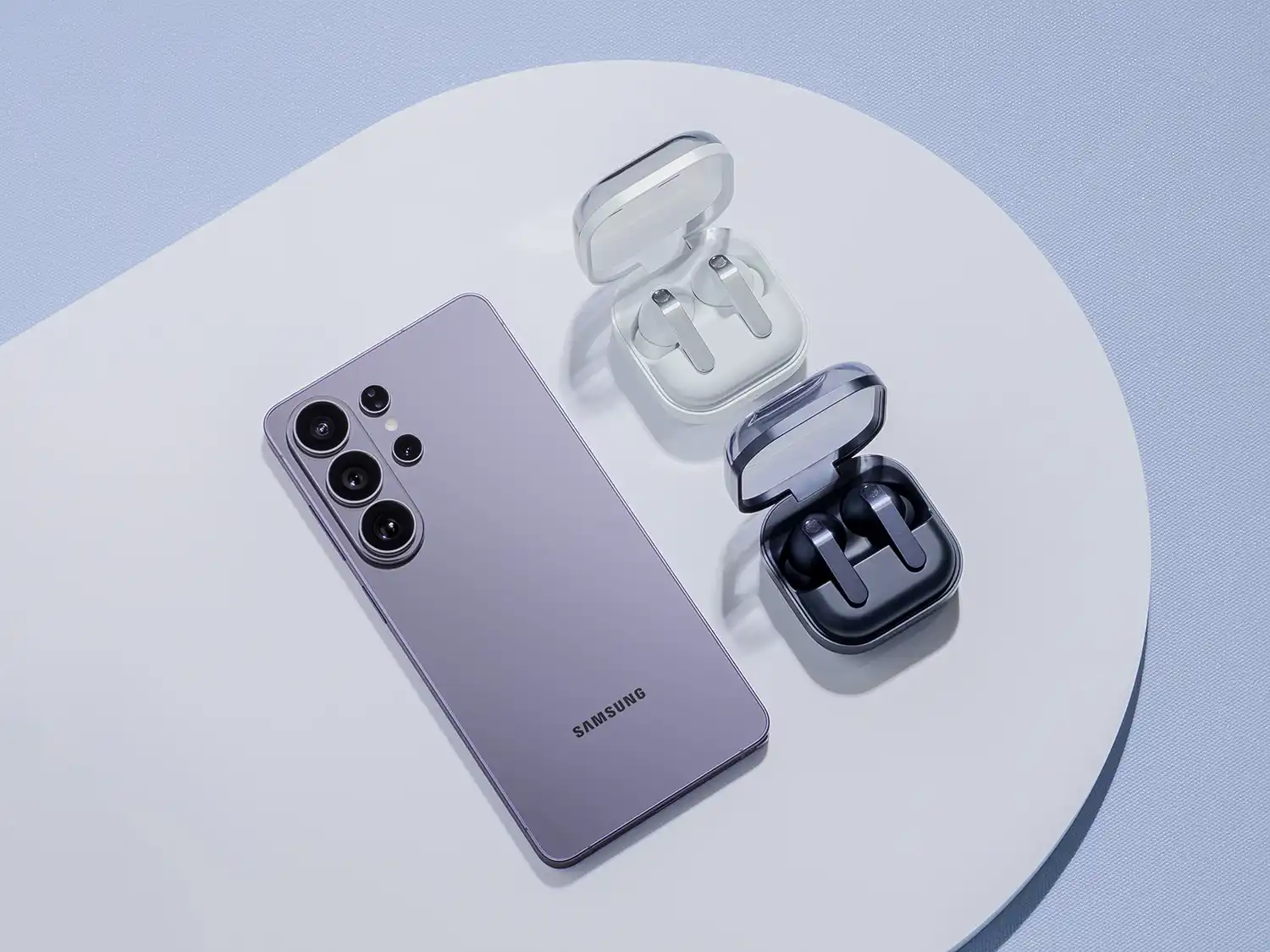 Top-down view of a Cobalt Violet Galaxy S26 Ultra alongside Galaxy Buds4 in White and Black cases.