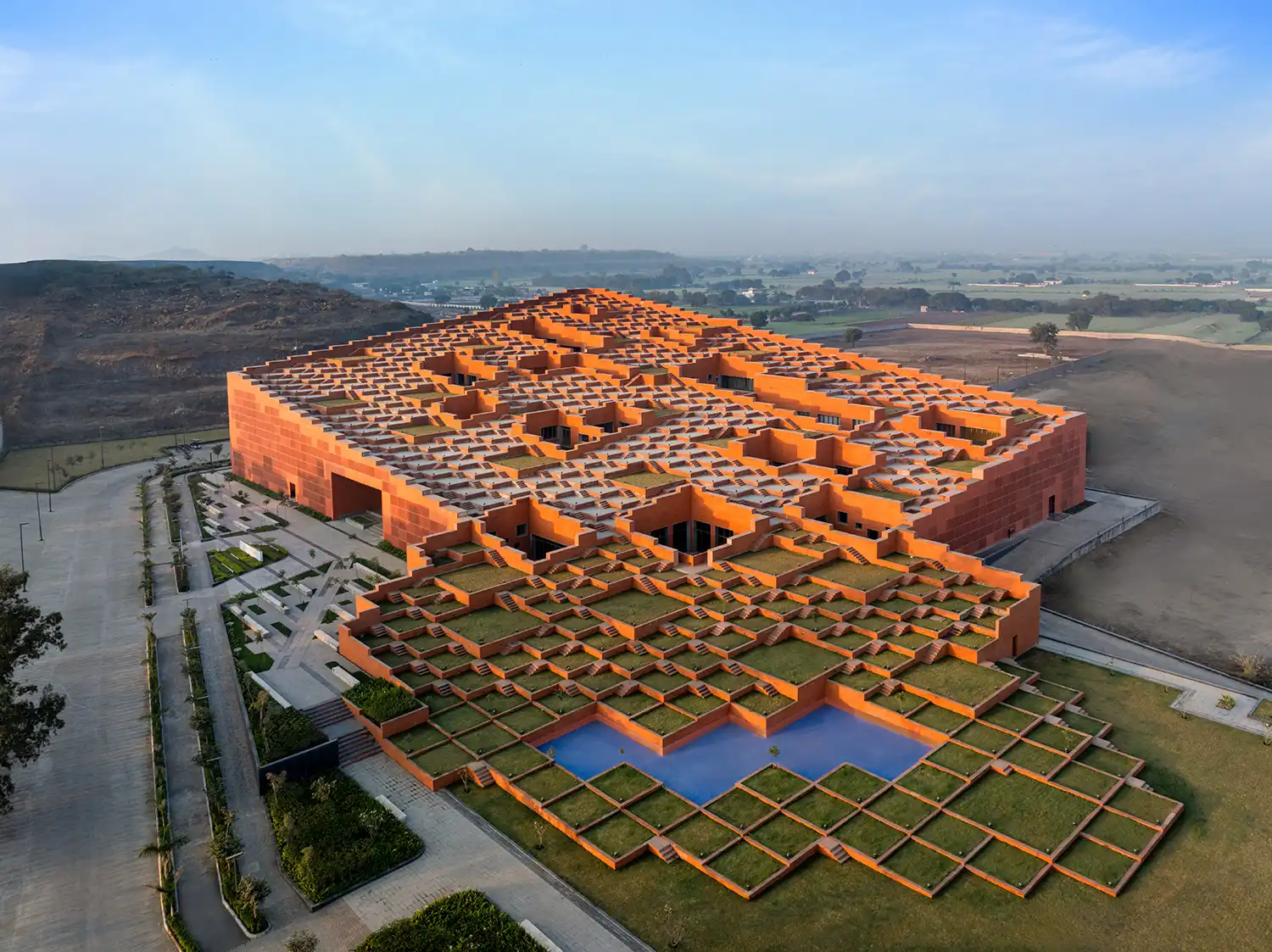Wide aerial shot of the entire Prestige University main building in Indore.