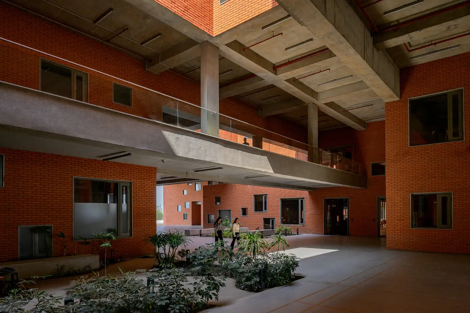 Interior view of the diagonal indoor street and bridge at Prestige University.