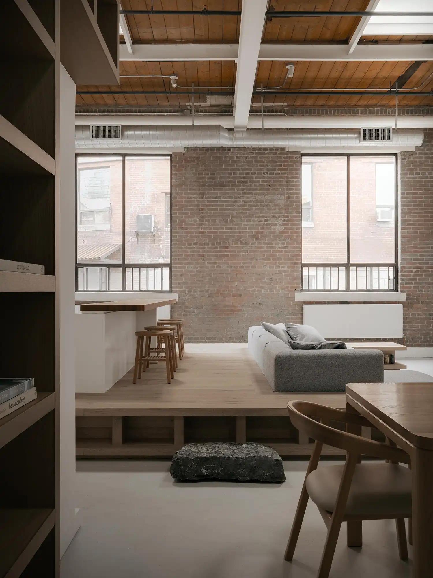 Exposed brick wall and south-facing windows in Toronto industrial loft