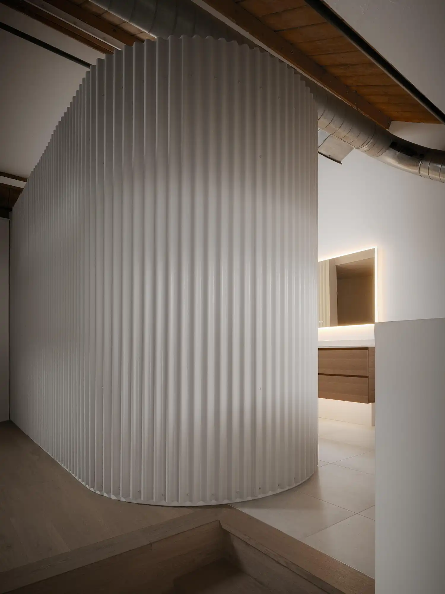 Corrugated metal bath pod in a contemporary Toronto loft renewal