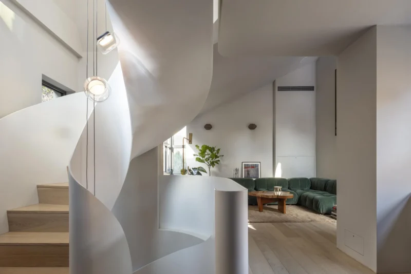 Sculptural white helix staircase in a modern London living room by Archi-Tectonics.