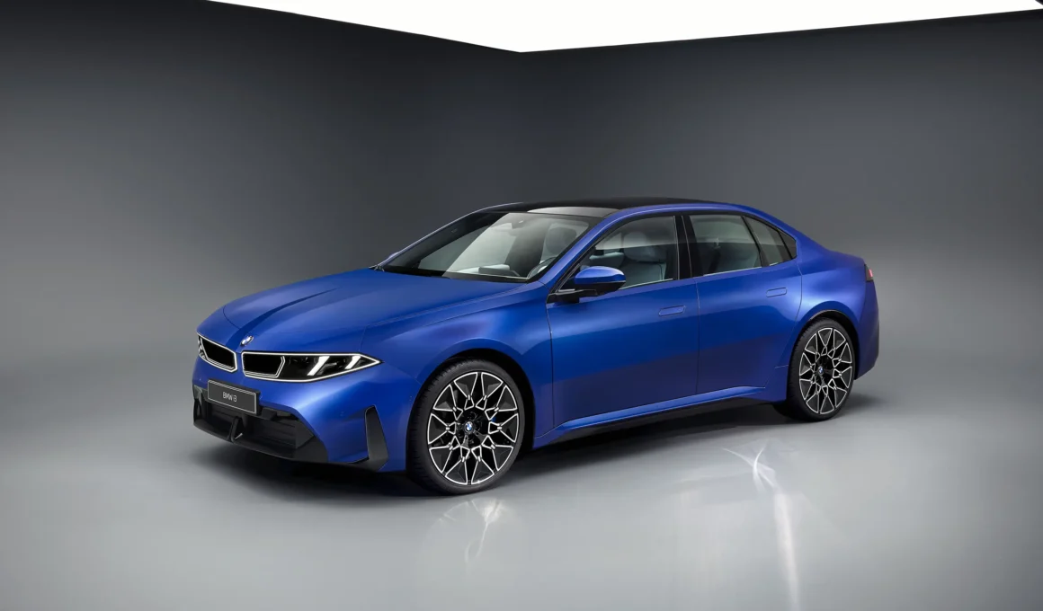 Side profile of the blue BMW i3 Neue Klasse sedan in a studio setting.