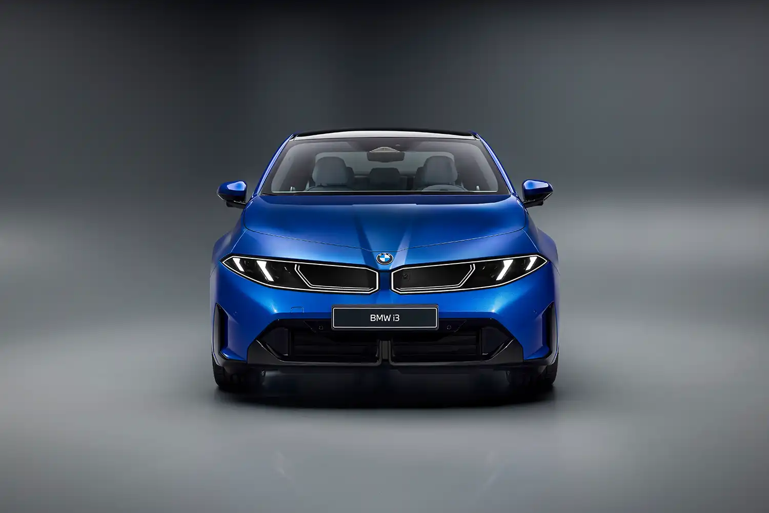 Front view of the BMW i3 showing the digital kidney grille and light signature.