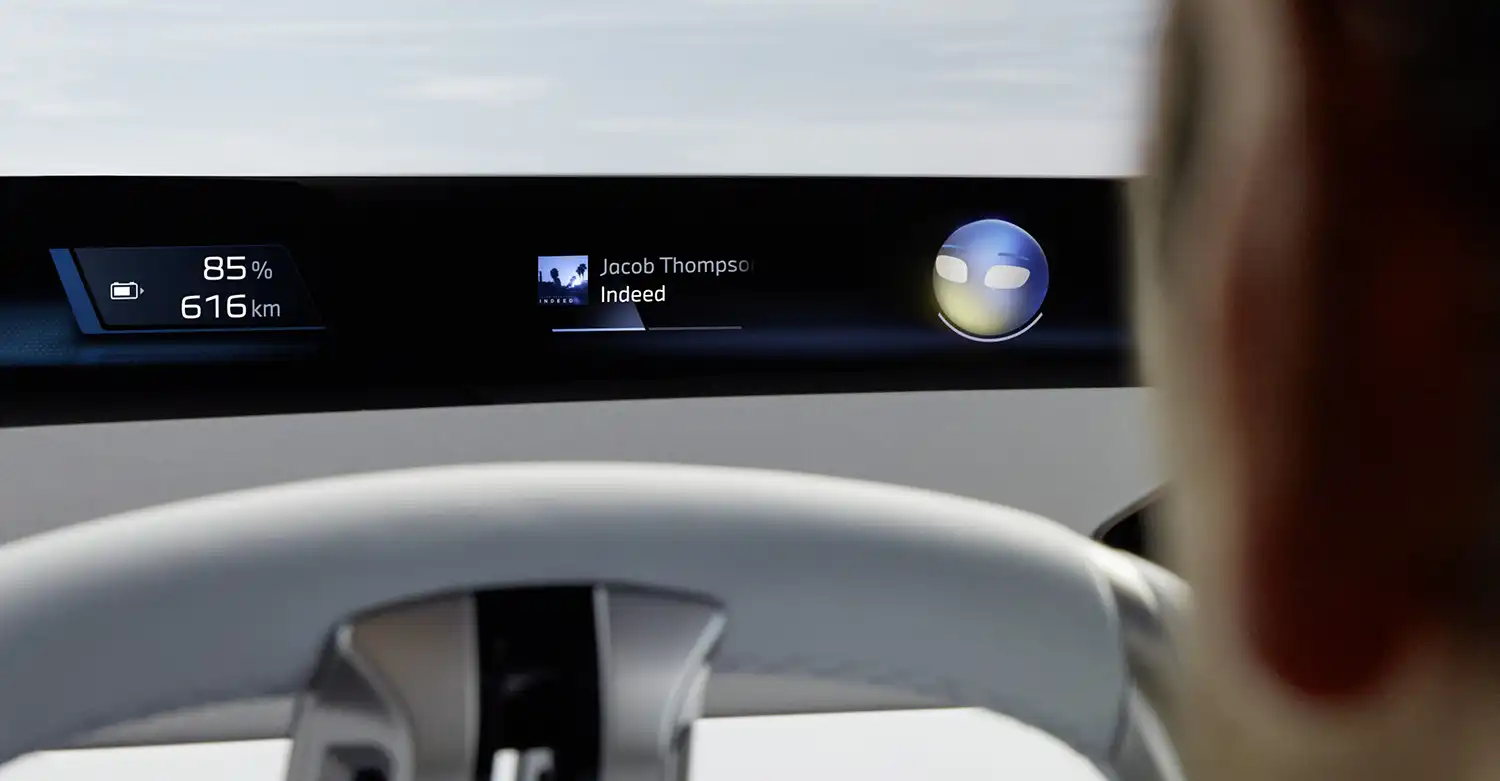 Close-up of BMW Panoramic Vision projecting range and media info on the windshield.