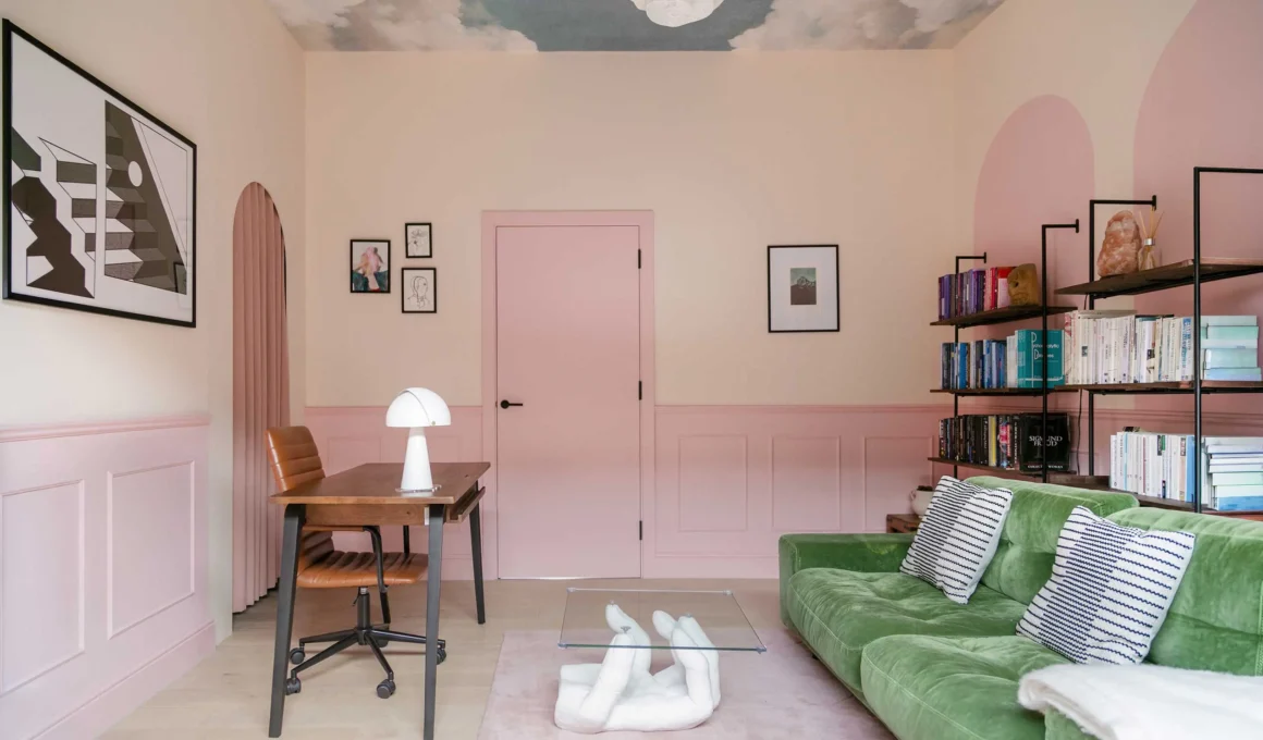 An immersive interior featuring a monochromatic pink wrap and a cloud mural ceiling, demonstrating how color palette and ceiling design influence spatial perception and cognitive focus. (Main image for urdesign article on 'The Fifth Wall')