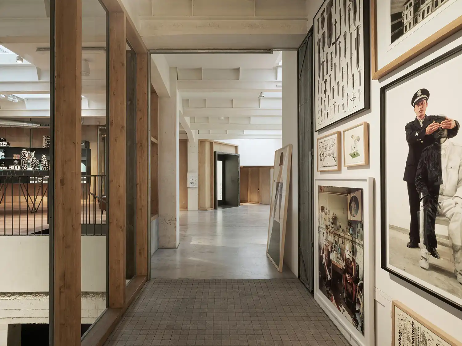 Hallway in SOLO CSV art center with a gallery wall featuring diverse illustrations and photography.