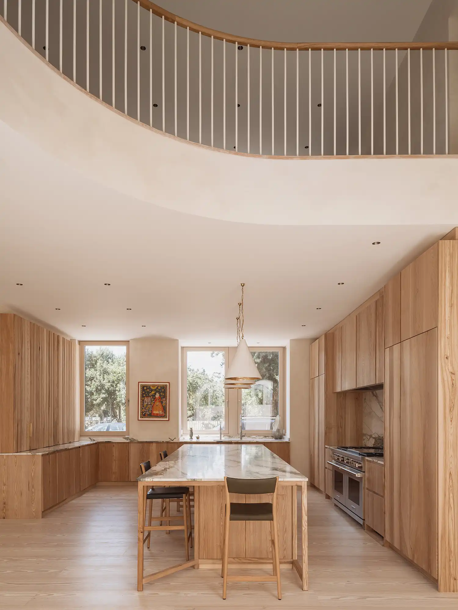 Double-height kitchen and dining space with Sebastian Cox ash joinery.