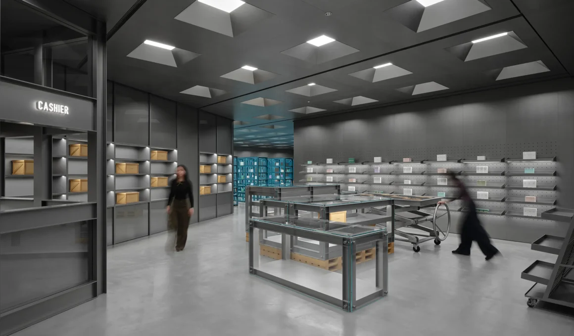 Wide view of HARMAY Beijing retail interior with industrial lighting and steel display units.