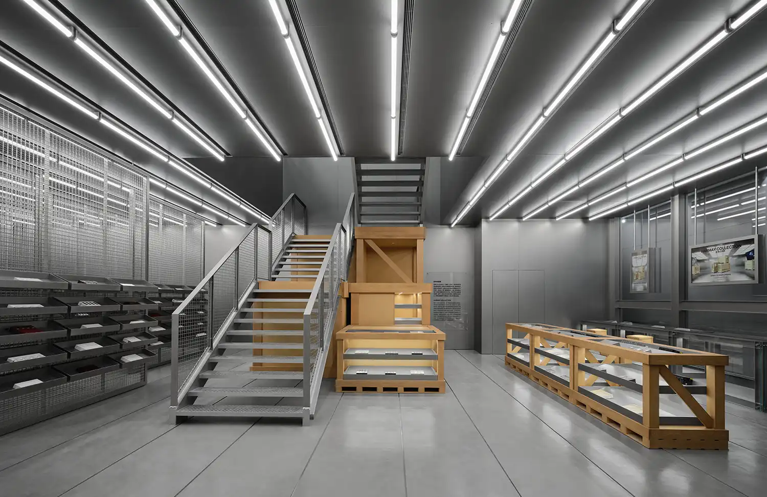 Central steel staircase integrated with wooden cargo boxes at HARMAY Beijing.