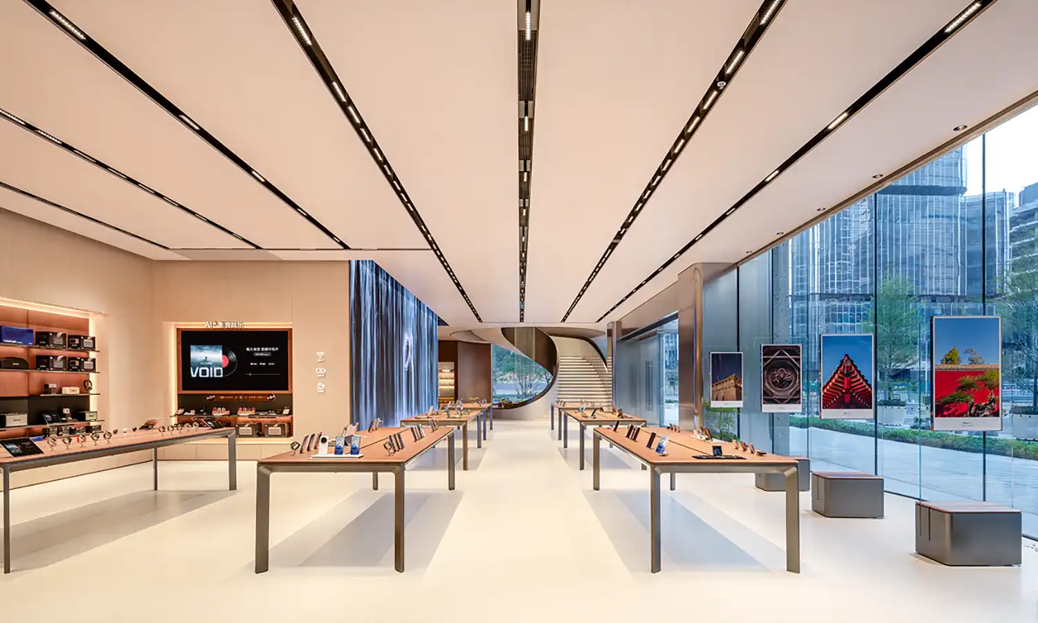 Interior ground floor of HONOR flagship featuring minimalism, minimalist tables, and curved walls