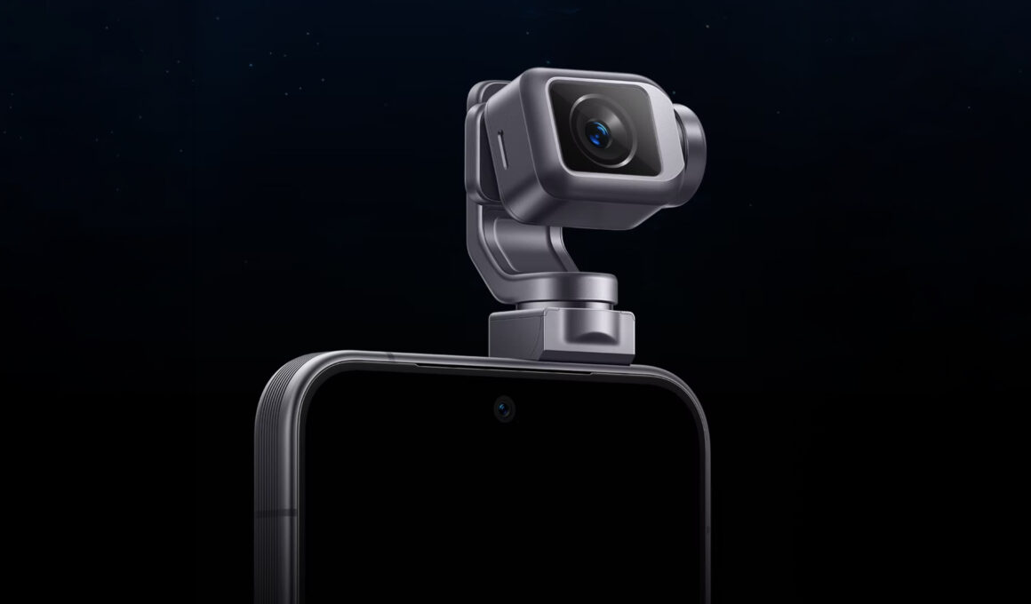 Close-up of a sleek smartphone with a metallic gimbal mechanism attached to the top, holding a camera lens.