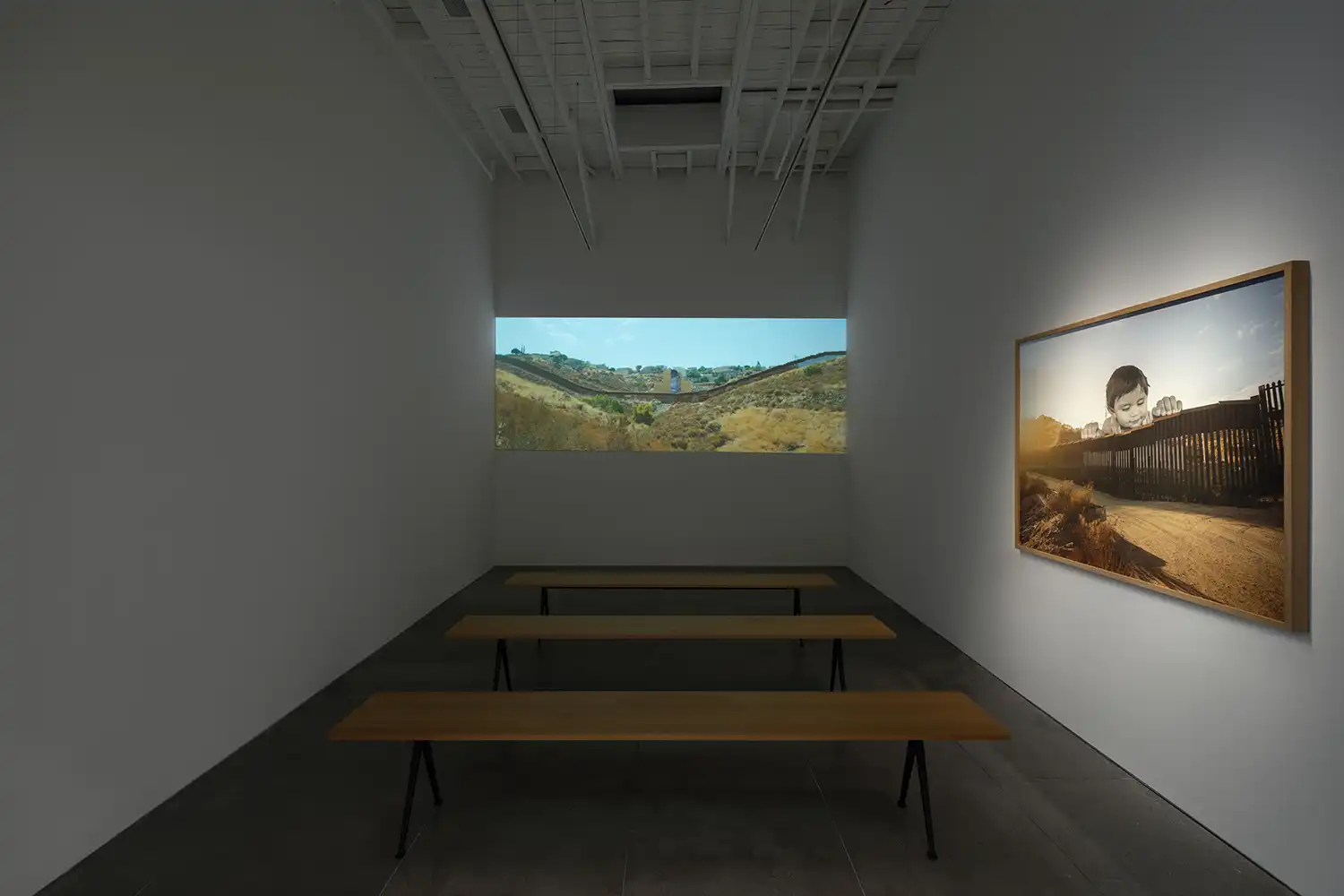 Exhibition view of JR's solo show 'Horizons' at Perrotin Los Angeles, featuring monumental ink-on-wood installations and photographic works.