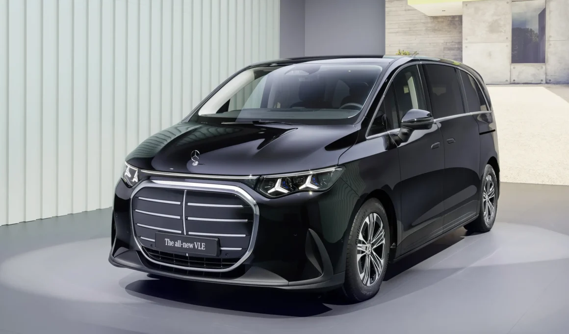 Front three-quarter view of the black Mercedes-Benz VLE electric limousine in a studio.