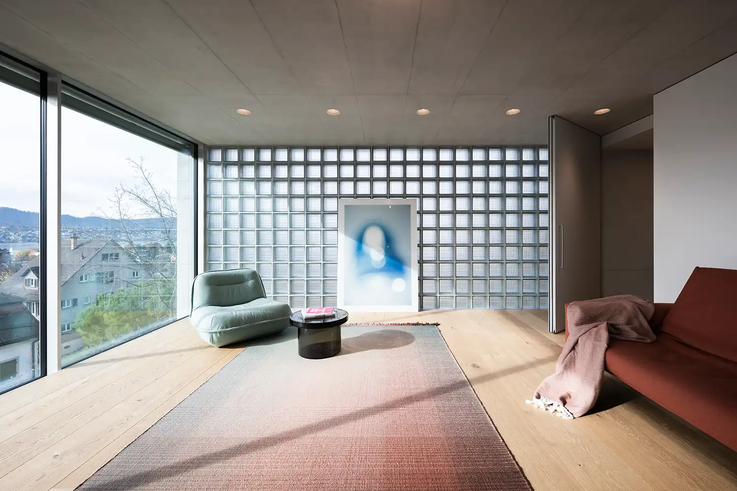Glass block wall interior Atrium Villa Zurich NOA Network of Architecture mint green armchair