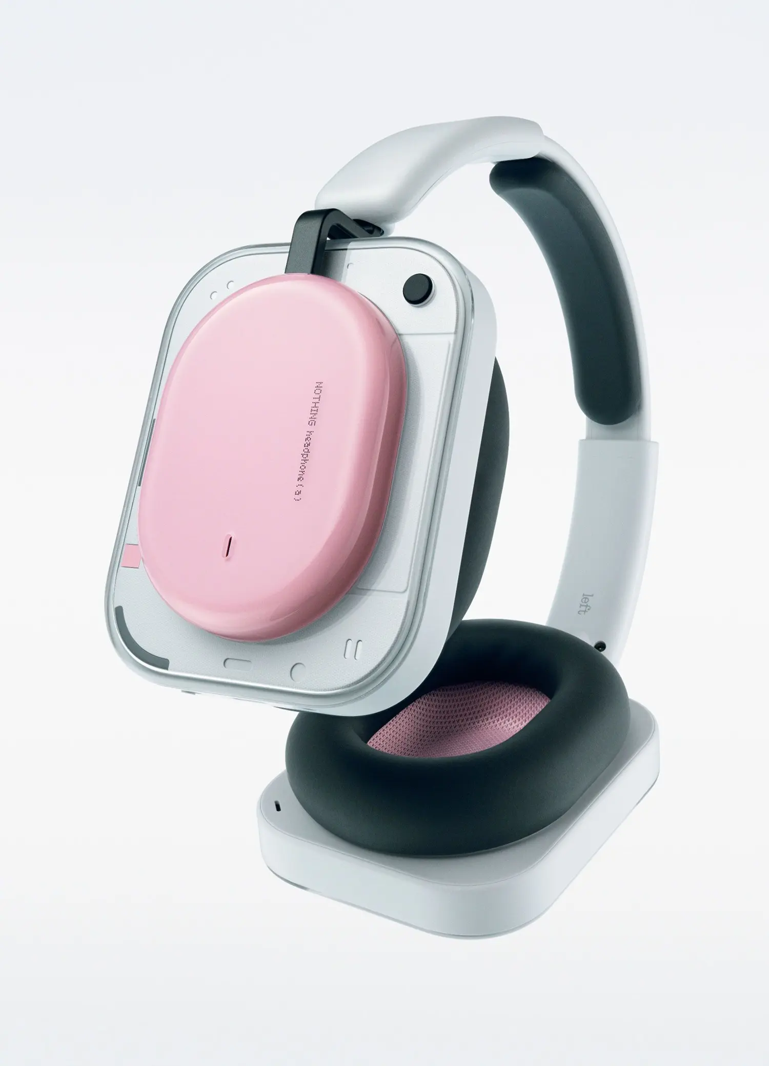 Perspective view of the pink Nothing Headphone (a) showing the transparent casing and black cushion.