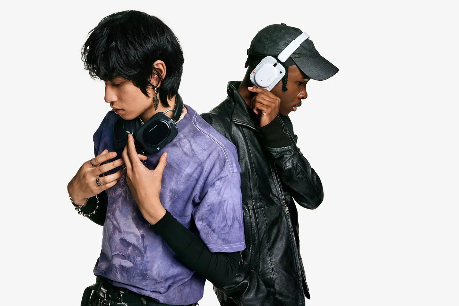 Two individuals wearing the black and white versions of Nothing Headphone (a).