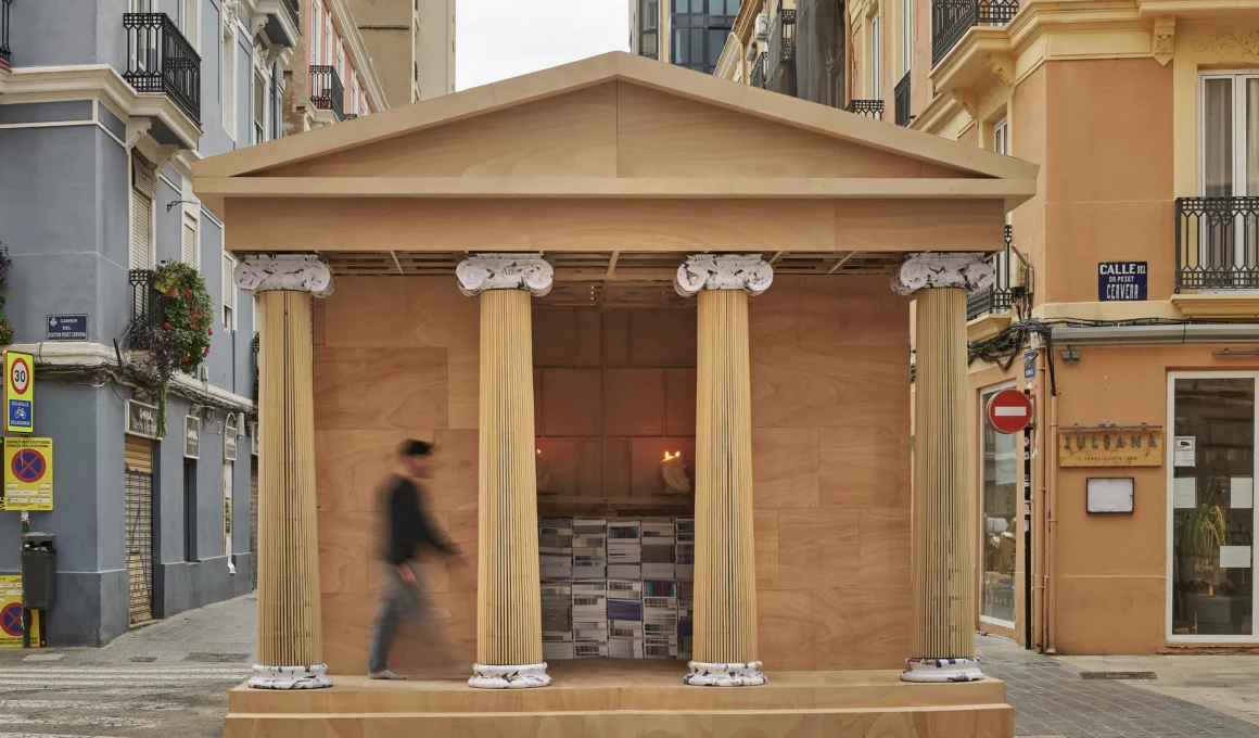 Front view of PichiAvo's wooden Ionic temple installation in a Valencia street.