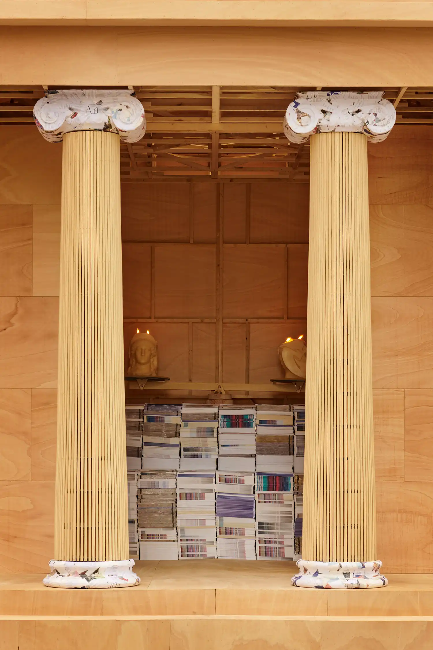 Close-up of the internal altar and Ionic columns made of wood and recycled paper.