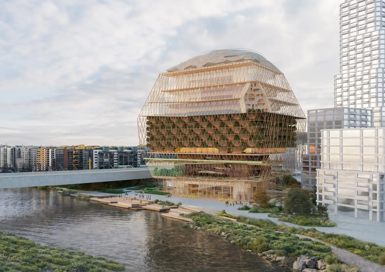 A modern, multi-tiered building with wooden lattice screens and integrated greenery, built along a riverbank with an elevated boardwalk in the foreground.
