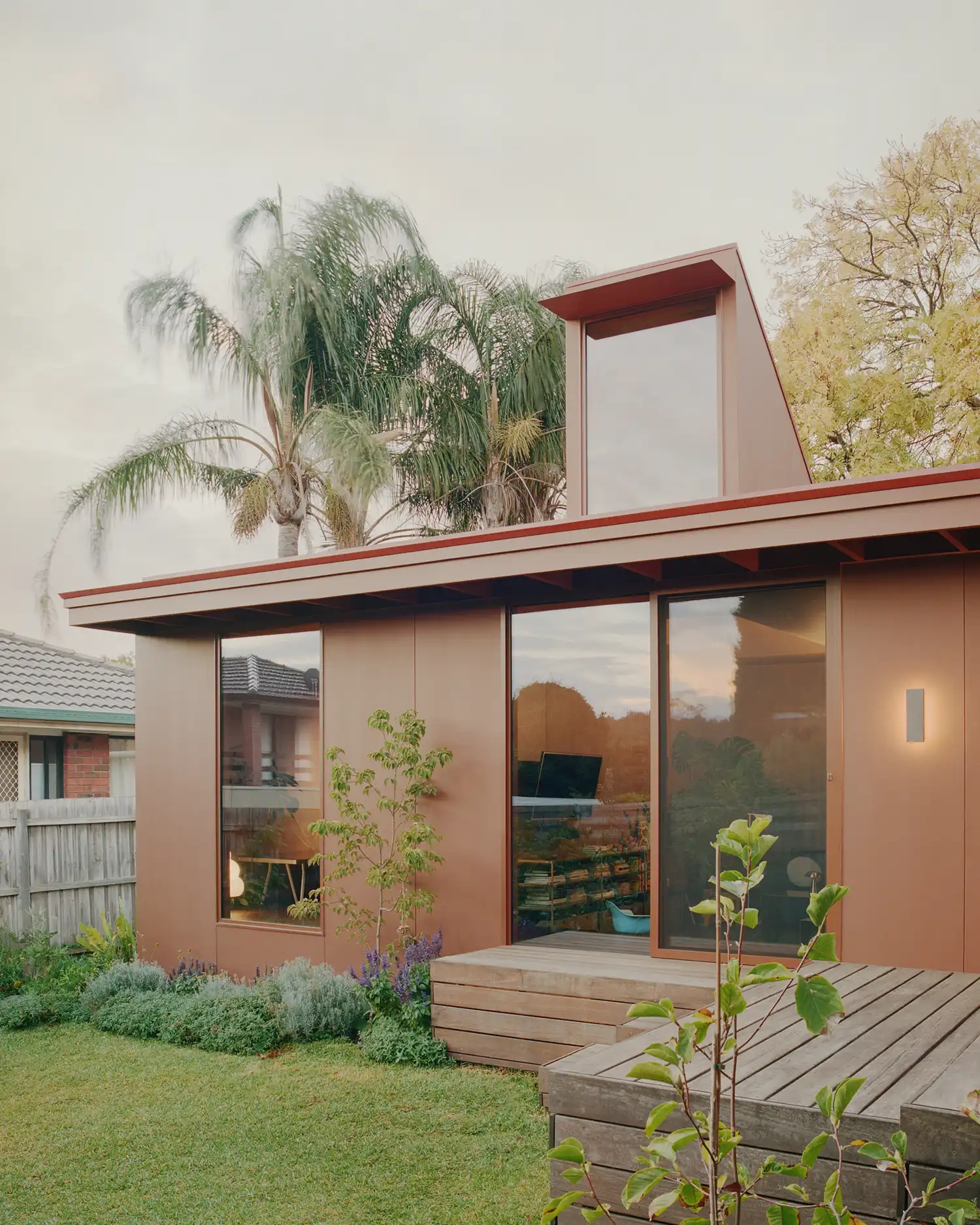 Exterior close-up of the addition's pop-up lantern window and garden connection in Victoria.