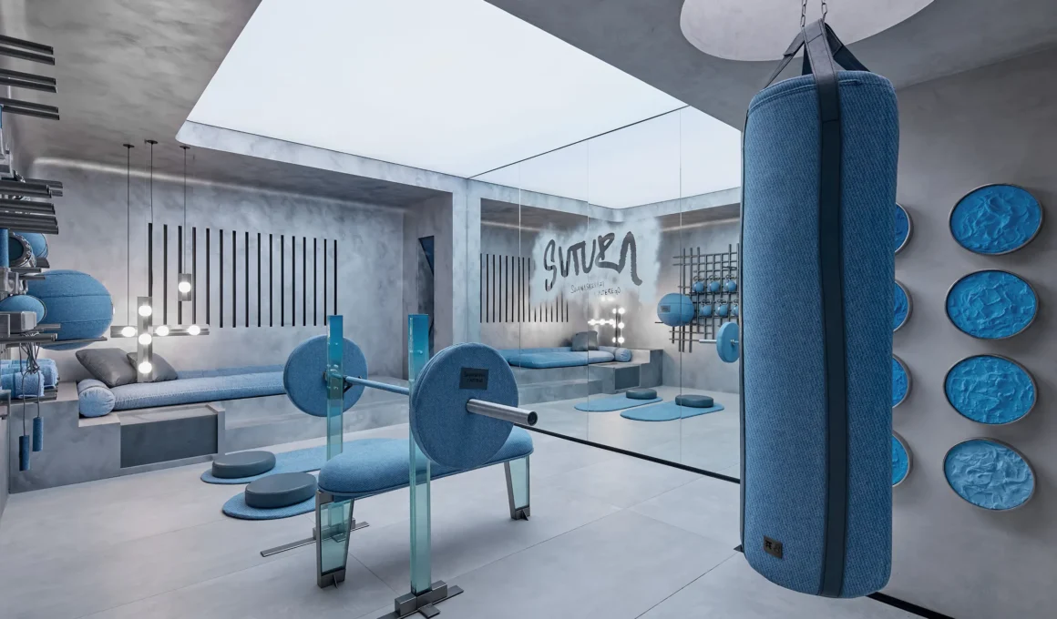Wide view of SUTURA gym featuring a denim-clad weight bench, punching bag, and glass-paneled walls in Mexico City.