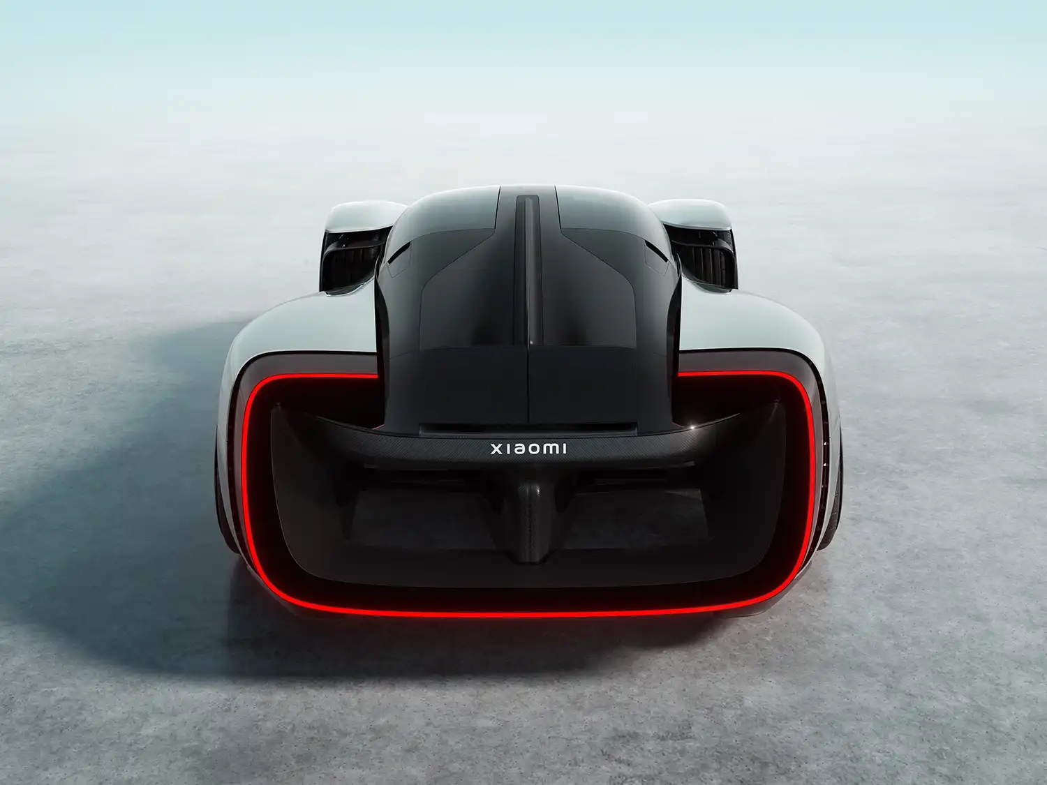 Rear view of the Xiaomi Vision Gran Turismo highlighting the halo-shaped red LED taillight and massive air outlet.