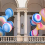 Vibrant, organic inflatable sculptures in a color-gradient landscape at the Serotonin installation by Sara Ricciardi for American Express at Milan Design Week 2026.