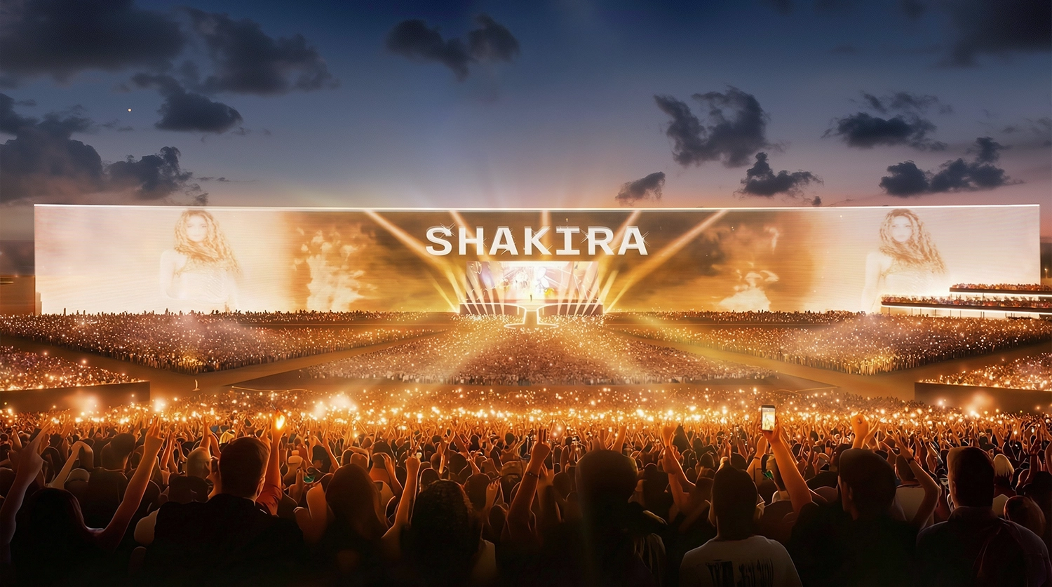 Ground-level view of a massive LED screen at the Shakira Stadium concert.