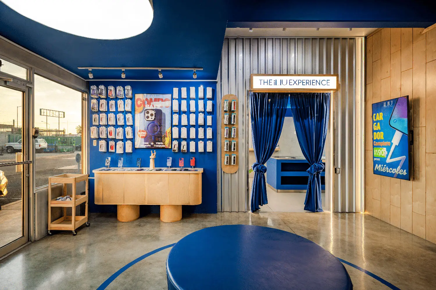 Corrugated metal wall and blue display area at the entrance of iLIU Experience.
