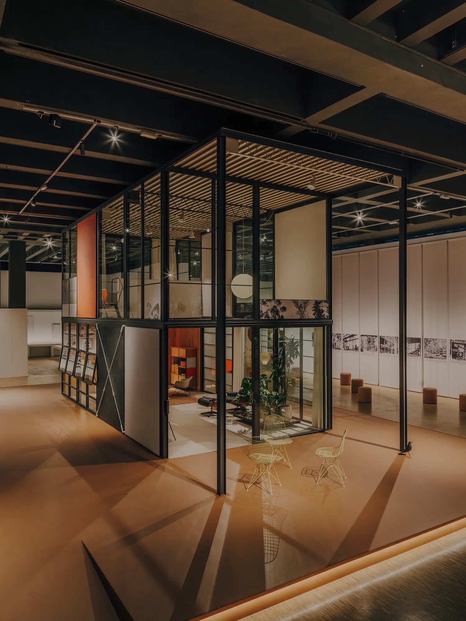 Two-story Eames Pavilion System structure installed inside Triennale Milano.