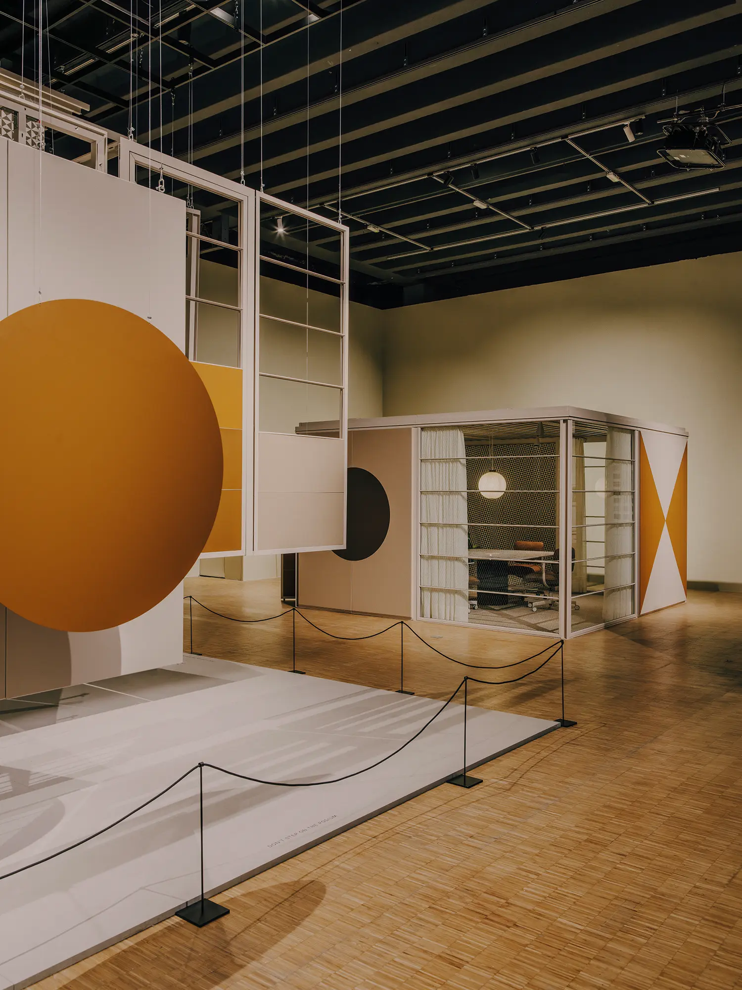 Overview of The Eames Houses exhibition hall at Triennale Milano.